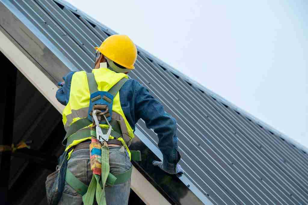 High Elevations Roofing | Building Worker Help With at Construction Site